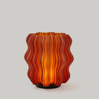 Cordless Mini Wavy Lamp silo in Amber — warm translucent 3D-printed designer accent lamp
